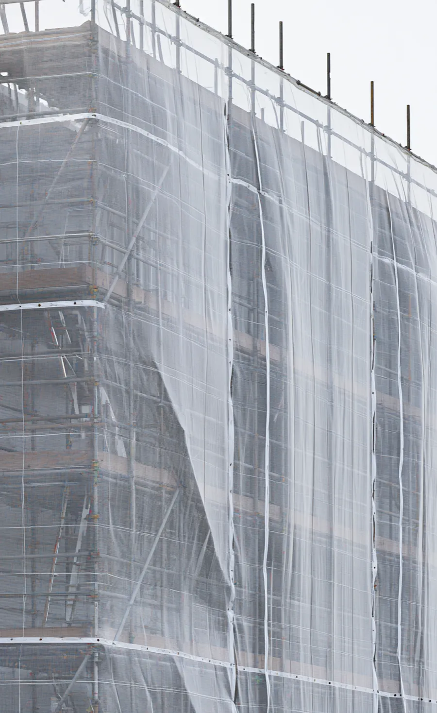 Commercial building wrapped in scaffolding for external maintenance by McGregor Builders