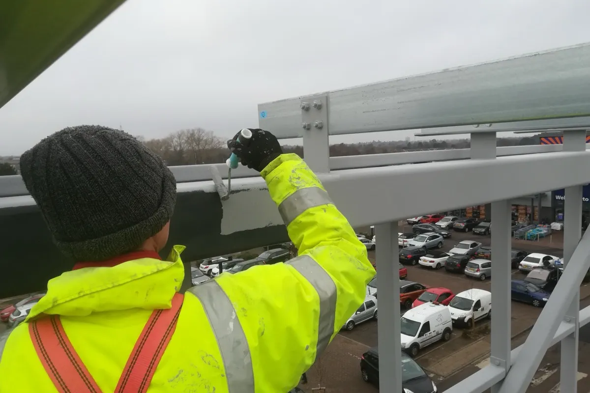 Painting and external maintenance to galvanised steel walkway at height, Dreams store, Colchester, McGregor Builders